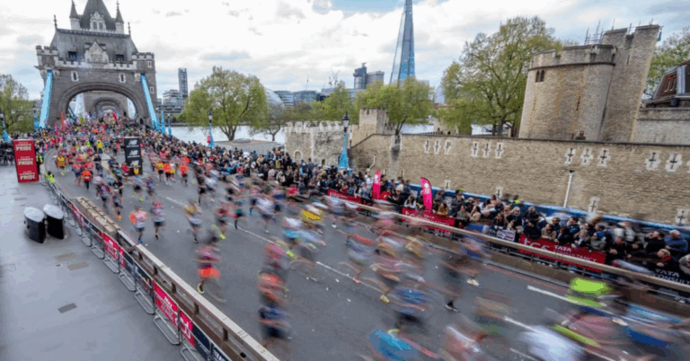 image of runners at London marathon crossing London bridge