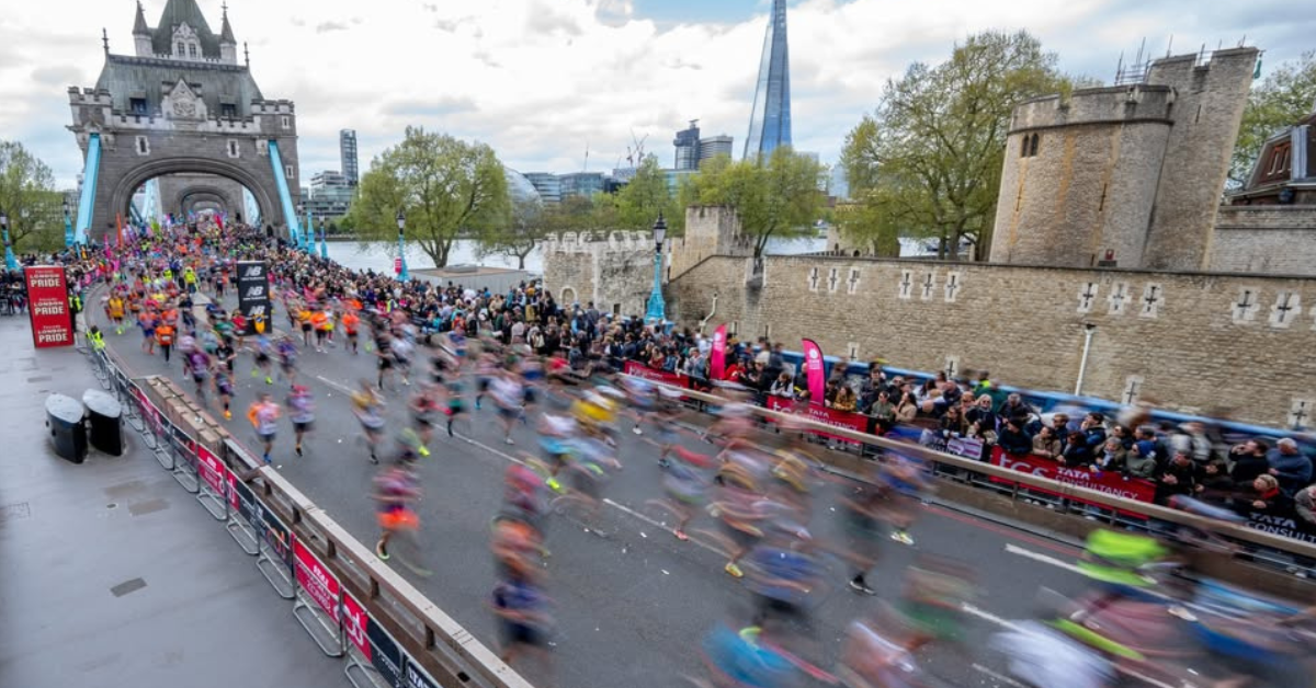 image of runners at London marathon crossing London bridge